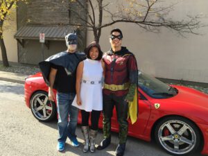 Princess Leia hanging out with batman and Robin on Halloween